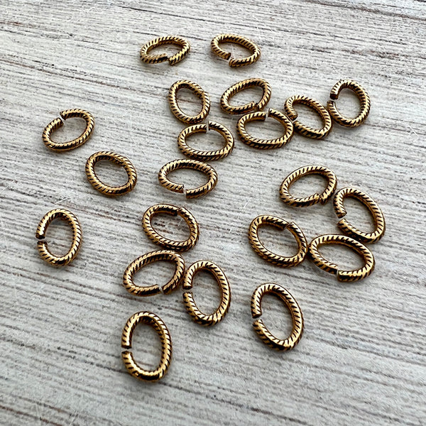 Load image into Gallery viewer, 6x8mm Oval Antiqued Gold Jump Rings, Textured Brass Jump Rings, 20 rings, GL-3010
